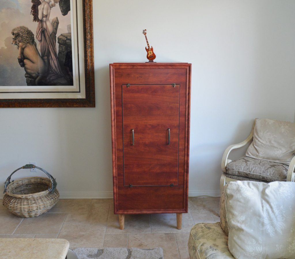 brown armoire in a bedroom