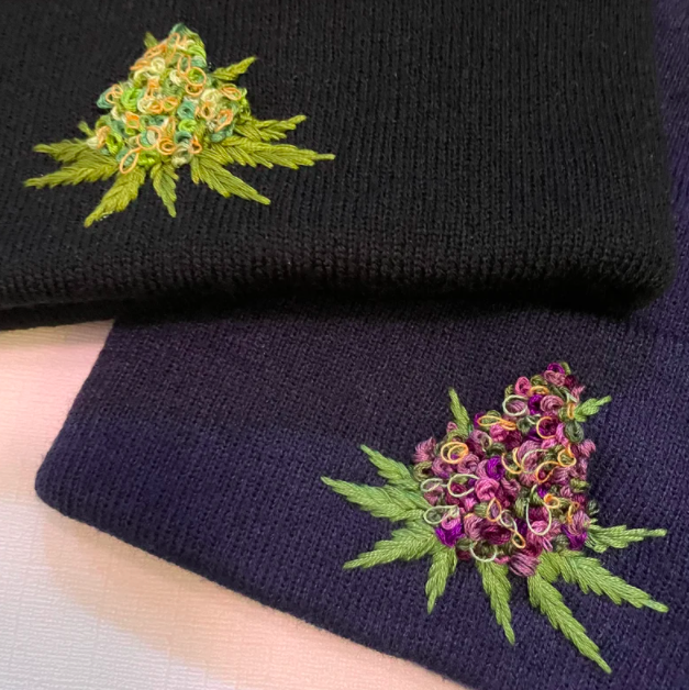 beanie embroidered with a marijuana flower